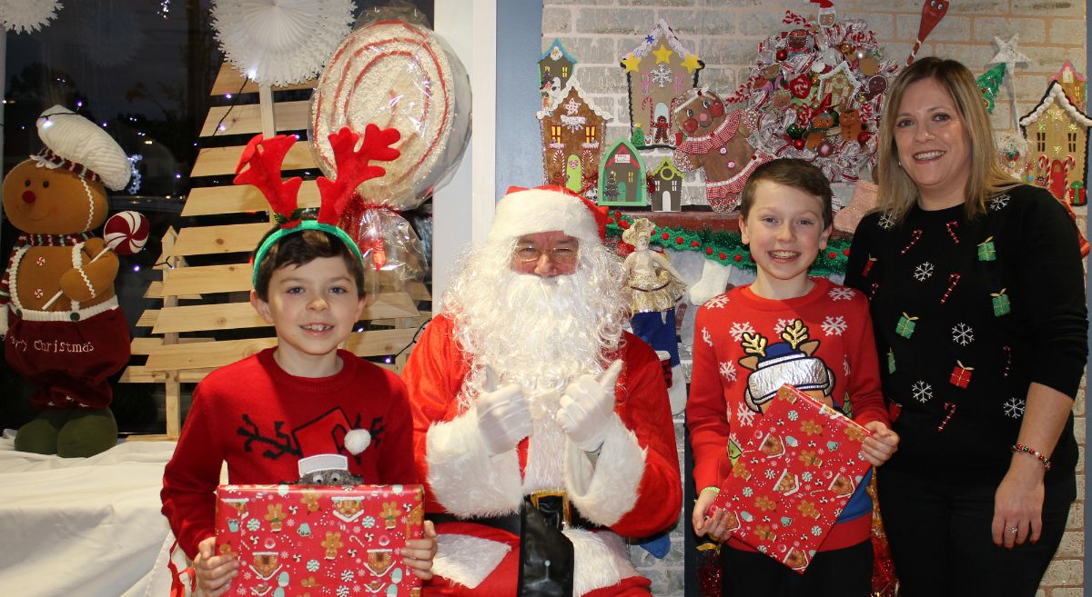 Noah, Harry and mum Suzanne with Santa